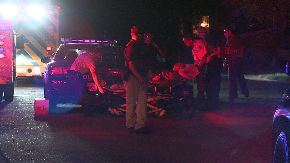 EMS prepares to transport homicide suspect to hospital