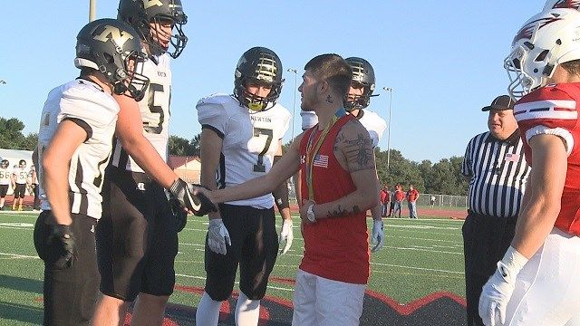 Nico Hernandez tosses coin, meets fans at local football game - KAKE