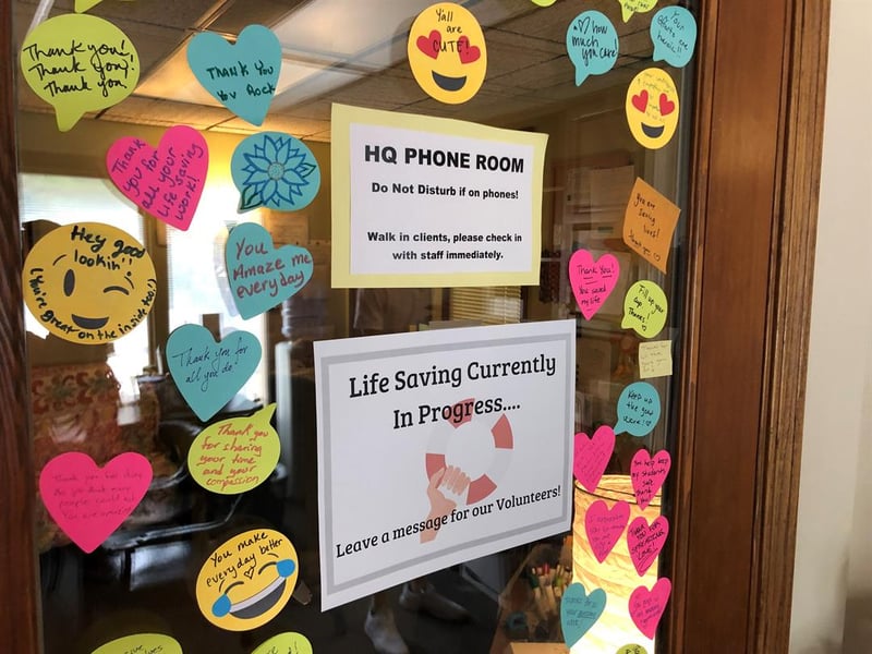 The door to the current National Suicide Prevention Hotline call center in Lawrence, Kansas. Taking calls from Kansans is tough, so Monica Kurz says they decorate the door with motivational phrases and encouragement.