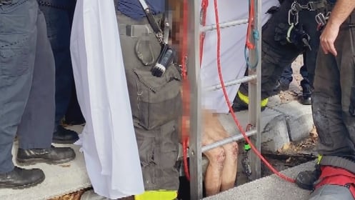 Woman rescued from storm drain