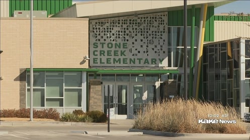 Man brings gun to Derby School