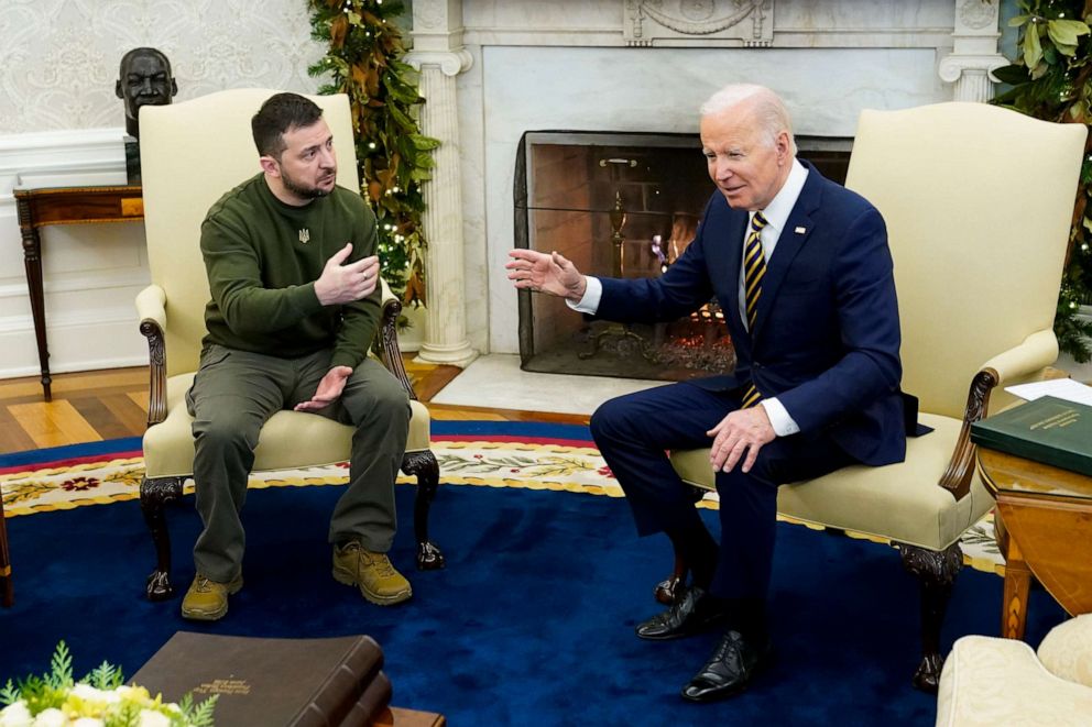 President Joe Biden speaks with Ukrainian President Volodymyr Zelenskyy as they meet in the Oval Office of the White House, Dec. 21, 2022, in Washington.