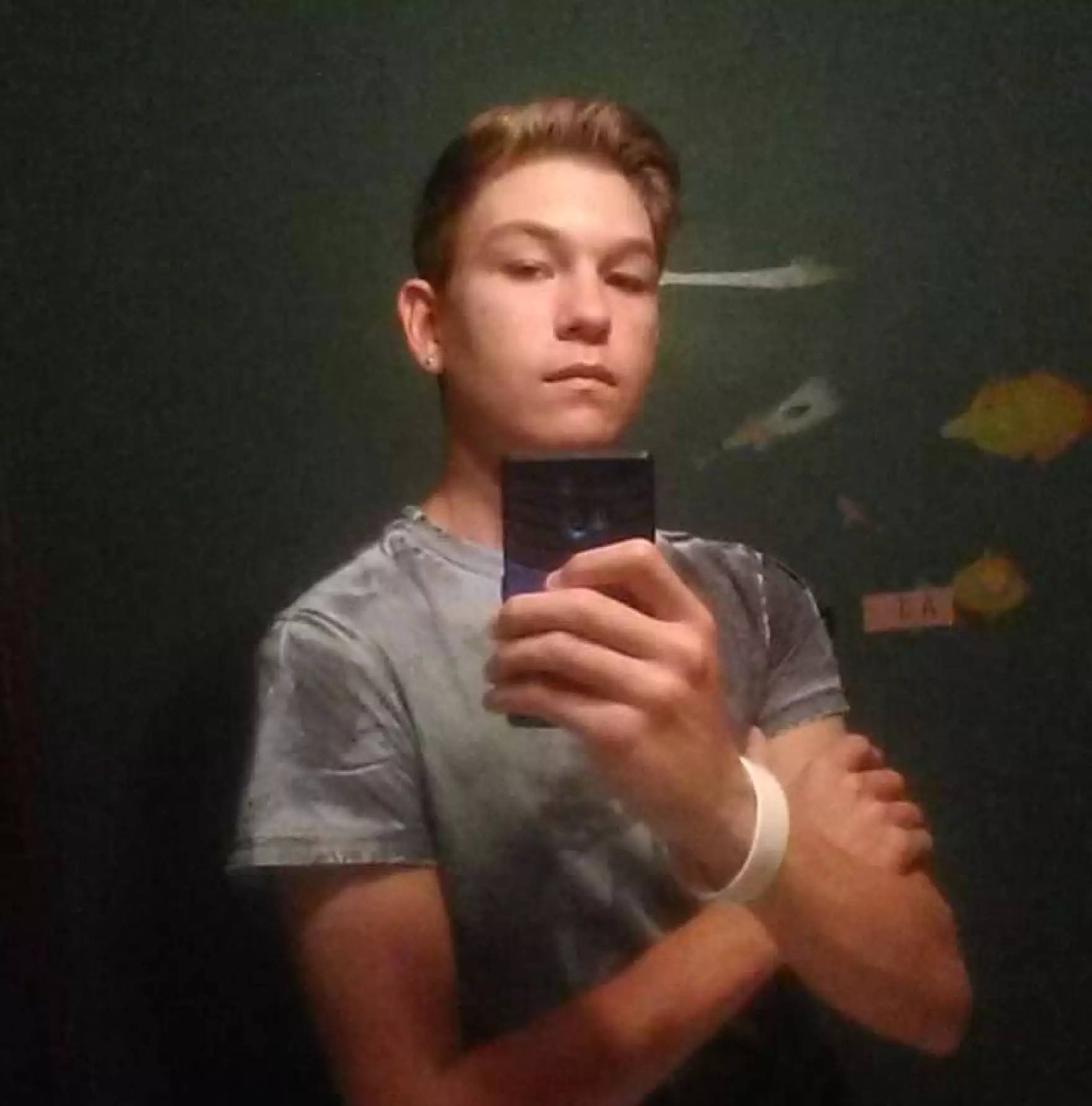 AJ Iverson poses for a mirror selfie taken before his death.