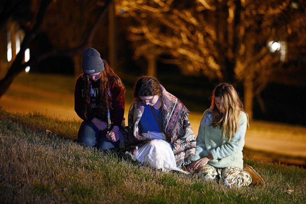 Children gather outside the Covenant School building at the Covenant Presbyterian Church following a shooting, in Nashville, Tennessee, March 27, 2023.
