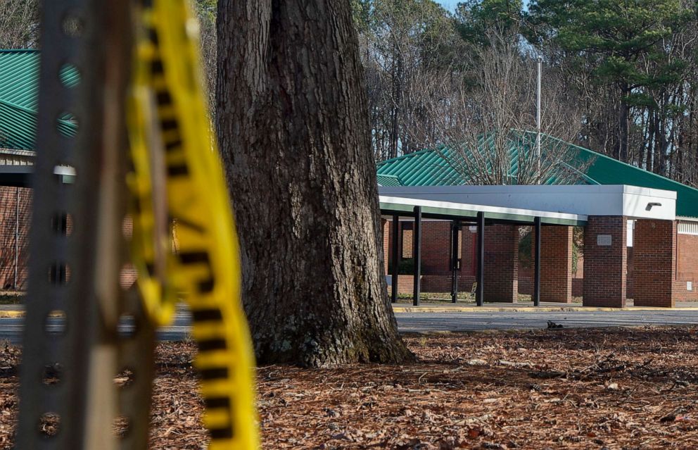 Police tape hangs from a sign post outside Richneck Elementary School, January 7, 2023, in Newport News, Virginia.