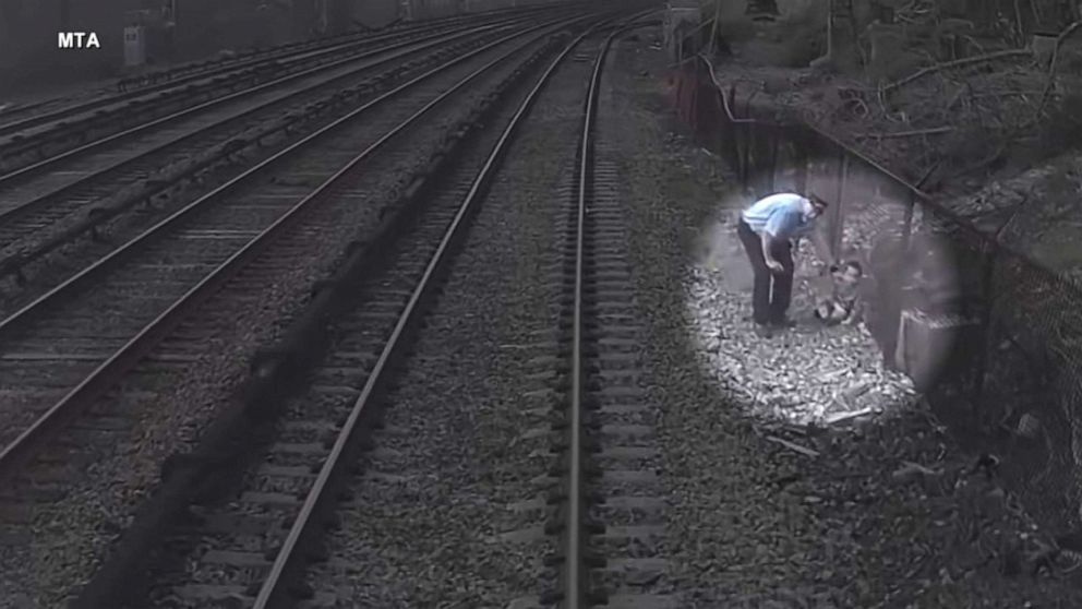 A Metro-North Railroad employee rescues a three-year-old boy who wandered onto train tracks in Tarrytown, New York, on April 6, 2023.