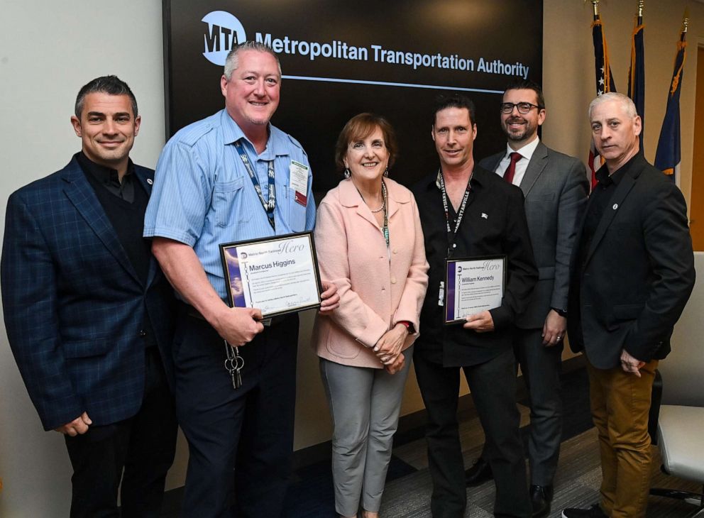 Metro-North President and Long Island Rail Road Interim President Catherine Rinaldi, center, poses for a photo after awarding commendations, April 25, 2023, to five employees involved in a daring rescue of a three-year-old boy.