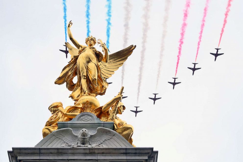 The Royal Air Force Aerobatic Team otherwise known as The Red Arrows fly over The Queen Victoria Memorial during the Coronation of King Charles III and Queen Camilla, May 06, 2023 in London.