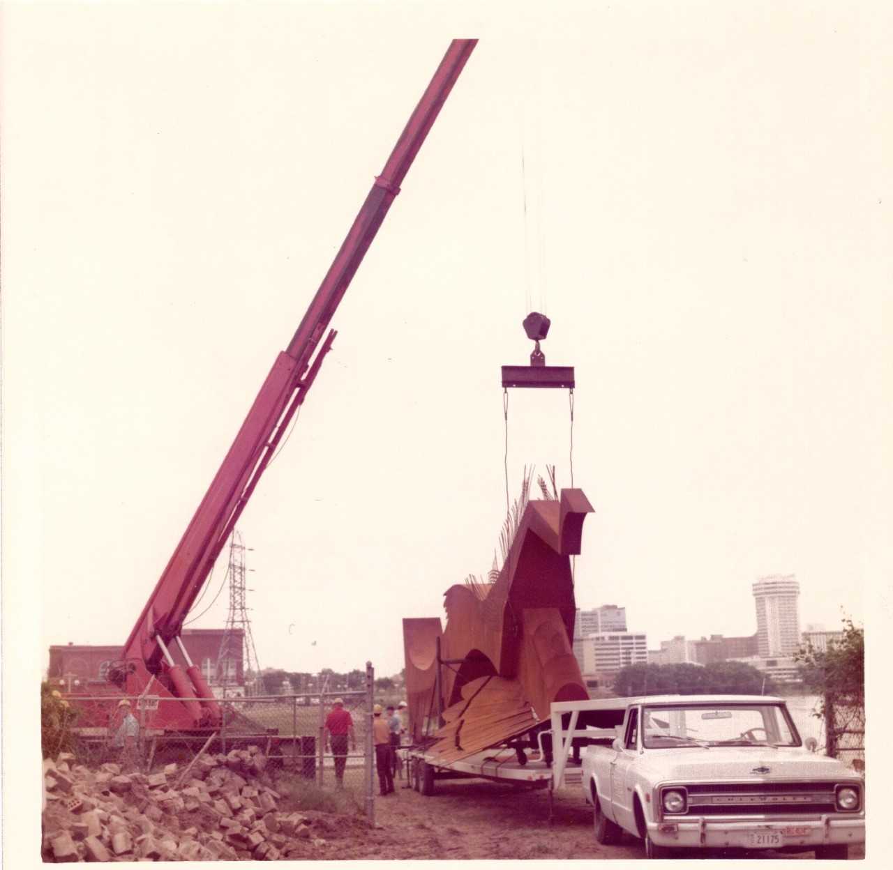 Crane operator Mario Barnoski beginning the process of lifting the Keeper of the Plains into place at the confluence of the Arkansas and Little Arkansas Rivers on May 18, 1974. Barnoski's family says they found this photo in an old scrapbook.
