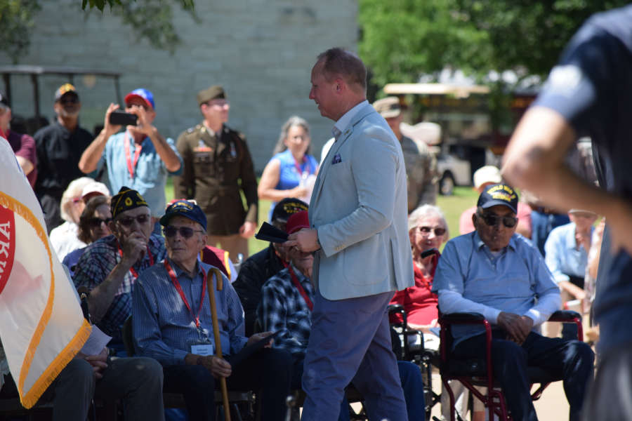 President Eisenhower's great-grandson is handing out certificates of appreciation to World War II veterans at the D-Day memorial in Abilene on June 6, 2024.